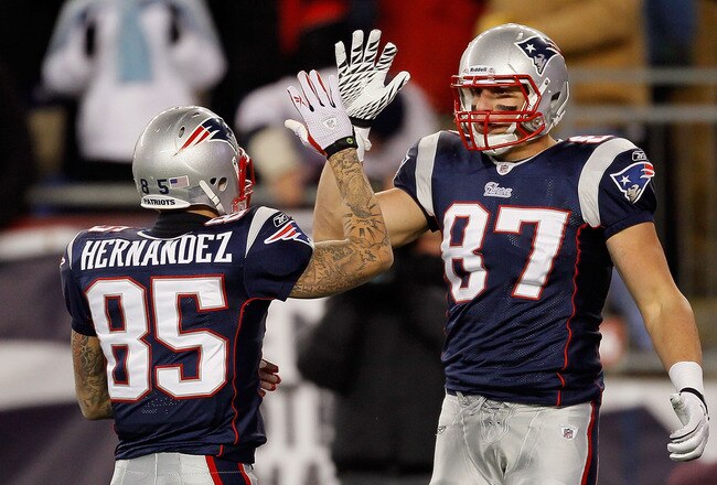 FOXBORO, MA - DECEMBER 06:  (L-R) Aaron Hernandez #85 and Rob Gronkowski #87 of the New England Patriots celebrate a play against the New York Jets at Gillette Stadium on December 6, 2010 in Foxboro, Massachusetts. The Patriots won 45-3. (Photo by Jim Rogash/Getty Images)