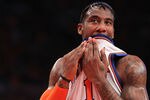 NEW YORK, NY - APRIL 24:  Amar'e Stoudemire #1 of the New York Knicks wipes his face with his jersey in the first quarter against the Boston Celtics in Game Four of the Eastern Conference Quarterfinals during the 2011 NBA Playoffs on April 24, 2011 at Madison Square Garden in New York City. NOTE TO USER: User expressly acknowledges and agrees that, by downloading and or using this photograph, User is consenting to the terms and conditions of the Getty Images License Agreement  (Photo by Nick Laham/Getty Images)