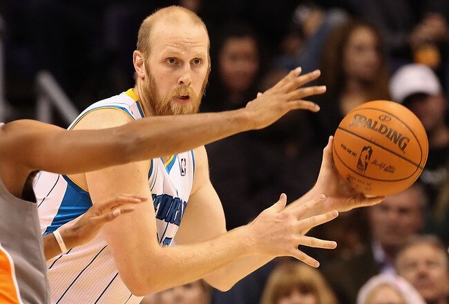 PHOENIX, AZ - DECEMBER 26:  Chris Kaman #35 of the New Orleans Hornets handles the ball during the season openning NBA game against the Phoenix Suns at US Airways Center on December 26, 2011 in Phoenix, Arizona.  The Hornets defeated the Suns 85-84. NOTE TO USER: User expressly acknowledges and agrees that, by downloading and or using this photograph, User is consenting to the terms and conditions of the Getty Images License Agreement.  (Photo by Christian Petersen/Getty Images)