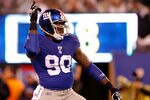 EAST RUTHERFORD, NJ - JANUARY 01:  Jason Pierre-Paul #90 of the New York Giants reacts after a sack in the first quarter against the Dallas Cowboys at MetLife Stadium on January 1, 2012 in East Rutherford, New Jersey.  (Photo by Rich Schultz/Getty Images)