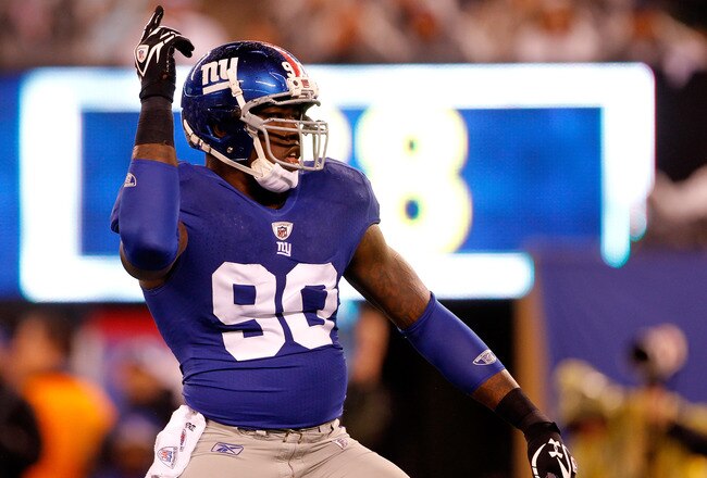 EAST RUTHERFORD, NJ - JANUARY 01:  Jason Pierre-Paul #90 of the New York Giants reacts after a sack in the first quarter against the Dallas Cowboys at MetLife Stadium on January 1, 2012 in East Rutherford, New Jersey.  (Photo by Rich Schultz/Getty Images)