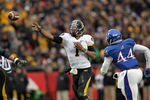 KANSAS CITY, MO - NOVEMBER 26:  Quarterback James Franklin #1 of the Missouri Tigers passes as he is persued by linebacker Malcolm Walker #44 of the Kansas Jayhawks during the game on November 26, 2011 at Arrowhead Stadium  in Kansas City, Missouri.  (Photo by Jamie Squire/Getty Images)
