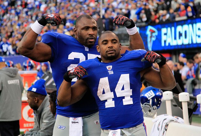EAST RUTHERFORD, NJ - JANUARY 08:  (L-R) Brandon Jacobs #27 and Ahmad Bradshaw #44 of the New York Giants celebrates after the GIants won 24-2 against the Atlanta Falcons during their NFC Wild Card Playoff game at MetLife Stadium on January 8, 2012 in East Rutherford, New Jersey.  (Photo by Chris Trotman/Getty Images)