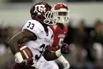 ARLINGTON, TX - OCTOBER 01:  Christine Michael #33 of the Texas A&M Aggies runs for a touchdown against the Arkansas Razorbacks at Cowboys Stadium on October 1, 2011 in Arlington, Texas.  (Photo by Ronald Martinez/Getty Images)