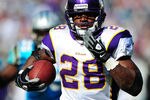 CHARLOTTE, NC - OCTOBER 30: Adrian Peterson #28 of the Minnesota Vikings runs with a catch for a touchdown against the Carolina Panthers at Bank of America Stadium on October 30, 2011 in Charlotte, North Carolina. (Photo by Scott Cunningham/Getty Images)