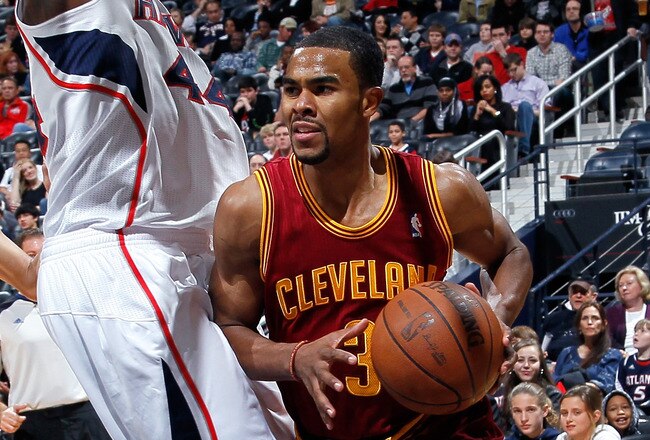 ATLANTA, GA - JANUARY 21:  Ramon Sessions #3 of the Cleveland Cavaliers drives against Jannero Pargo #7 and Ivan Johnson #44 of the Atlanta Hawks at Philips Arena on January 21, 2012 in Atlanta, Georgia.  NOTE TO USER: User expressly acknowledges and agrees that, by downloading and or using this photograph, User is consenting to the terms and conditions of the Getty Images License Agreement.  (Photo by Kevin C. Cox/Getty Images)
