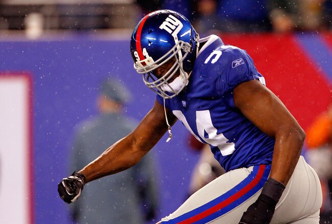 EAST RUTHERFORD, NJ - JANUARY 01:   Mathias Kiwanuka #94 of the New York Giants reacts after making a tackle for a lose against the Dallas Cowboys at MetLife Stadium on January 1, 2012 in East Rutherford, New Jersey.  (Photo by Rich Schultz/Getty Images)