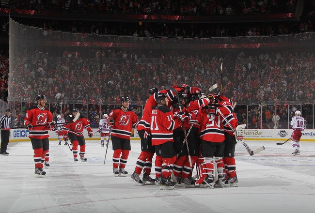 NEWARK, NJ - JANUARY 31:  The New Jersey Devils celebrate their 4-3 shoot out win over the New York Rangers at the Prudential Center on January 31, 2012 in Newark, New Jersey. (Photo by Bruce Bennett/Getty Images)