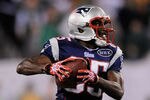 EAST RUTHERFORD, NJ - NOVEMBER 13:   Chad Ochocinco #85 of the New England Patriots runs with the ball at MetLife Stadium on November 13, 2011 in East Rutherford, New Jersey.  (Photo by Patrick McDermott/Getty Images)