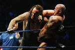 SYDNEY, AUSTRALIA - JUNE 15:  The Undertaker (L) pushes Bam Neely into the corner during WWE Smackdown at Acer Arena on June 15, 2008 in Sydney, Australia.  (Photo by Gaye Gerard/Getty Images)