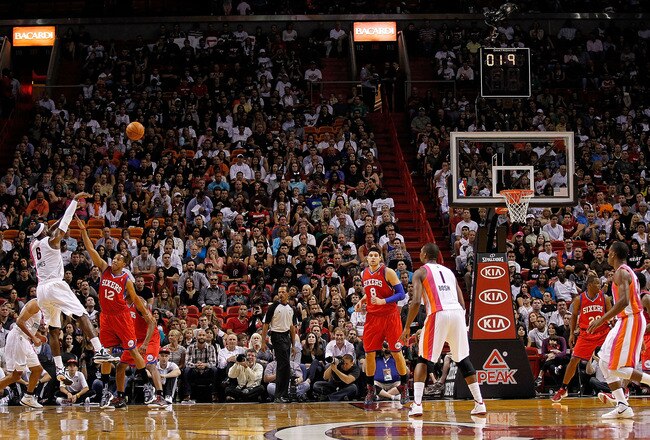 MIAMI, FL - JANUARY 21: LeBron James #6 of the Miami Heat shoots over Evan Turner #12 of the Philadelphia 76ers during a game at American Airlines Arena on January 21, 2012 in Miami, Florida. NOTE TO USER: User expressly acknowledges and agrees that, by downloading and/or using this Photograph, User is consenting to the terms and conditions of the Getty Images License Agreement.  (Photo by Mike Ehrmann/Getty Images)