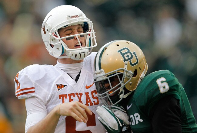 WACO, TX - DECEMBER 03:  Case McCoy #6 of the Texas Longhorns is hit by Ahmad Dixon #6 of the Baylor Bears during a game at Floyd Casey Stadium on December 3, 2011 in Waco, Texas.  (Photo by Sarah Glenn/Getty Images)