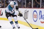 VANCOUVER, CANADA - JANUARY 21: Joe Pavelski #8 of the San Jose Sharks chases after the puck during NHL action against the Vancouver Canucks on January 21, 2012 at Rogers Arena in Vancouver, British Columbia, Canada.  (Photo by Rich Lam/Getty Images)