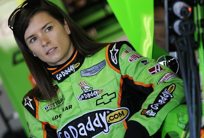 DAYTONA BEACH, FL - JANUARY 12:  Danica Patrick, driver of the #10 GoDaddy.com Chevrolet, stands in the garage area during Daytona Preseason Thunder at Daytona International Speedway on January 12, 2012 in Daytona Beach, Florida.  (Photo by Jared C. Tilton/Getty Images for NASCAR)