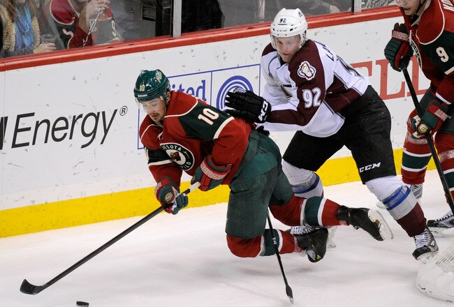 ST PAUL, MN - NOVEMBER 17: Gabriel Landeskog #92 of the Colorado Avalanche trips Devin Setoguchi #10 of the Minnesota Wild in the third period on November 17, 2011 at Xcel Energy Center in Minneapolis, Minnesota. The Wild defeated the Avalanche 1-0. (Photo by Hannah Foslien/Getty Images)