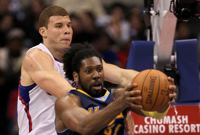 LOS ANGELES, CA - MARCH 05:  Nene #31 of the Denver Nuggets grabs a rebound from Blake Griffin #32 of the Los Angeles Clippers at Staples Center on March 5, 2011 in Los Angeles, California. The Clippers won 100-94. NOTE TO USER: User expressly acknowledges and agrees that, by downloading and or using this photograph, User is consenting to the terms and conditions of the Getty Images License Agreement.  (Photo by Stephen Dunn/Getty Images)