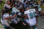 MIAMI GARDENS, FL - JANUARY 01:  Jason Taylor #99 of the Miami Dolphins prays after his final game against the New York Jets at Sun Life Stadium on January 1, 2012 in Miami Gardens, Florida.  (Photo by Mike Ehrmann/Getty Images)