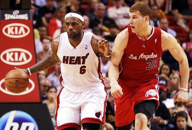 MIAMI - FEBRUARY 06:  Forward LeBron James #6 of the Miami Heat drives against guard Forward Blake Griffin #32 of the L.A. Clippers at American Airlines Arena on February 6, 2011 in Miami, Florida. NOTE TO USER: User expressly acknowledges and agrees that, by downloading and or using this photograph, User is consenting to the terms and conditions of the Getty Images License Agreement.  (Photo by Marc Serota/Getty Images)