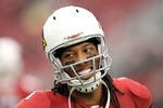 GLENDALE, AZ - JANUARY 01:  Wide receiver Larry Fitzgerald #11 of the Arizona Cardinals warms up before the NFL game against the Seattle Seahawks at the University of Phoenix Stadium on January 1, 2012 in Glendale, Arizona. The Cardinals defeated the Seahawks 23-20 in overtime. (Photo by Christian Petersen/Getty Images)