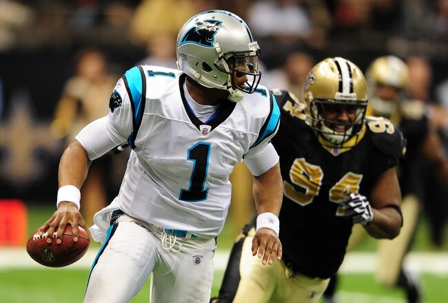 NEW ORLEANS, LA - JANUARY 1: Cam Newton #1 of the Carolina Panthers scrambles against Cameron Jordan #94 of the New Orleans Saints at the Mercedes-Benz Superdome on January 1, 2012 in New Orleans, Louisiana  (Photo by Scott Cunningham/Getty Images)