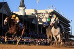 LOUISVILLE, KY - NOVEMBER 05:  Jockey Ramon Dominguez rides Hansen #5, far right, ahead of jockey Javier Castellano and Union Rags #10 to win the Breeders' Cup Juvenile during the 2011 Breeders' Cup World Championships at Churchill Downs on November 5, 2011 in Louisville, Kentucky.  (Photo by Rob Carr/Getty Images)