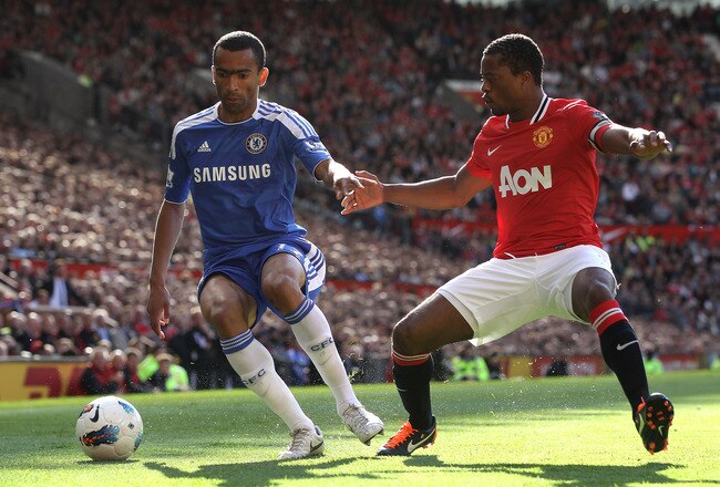 MANCHESTER, ENGLAND - SEPTEMBER 18:   Jose Bosingwa of Chelsea competes with Patrice Evra of Manchester United during the Barclays Premier League match between Manchester United and Chelsea at Old Trafford on September 18, 2011 in Manchester, England. (Photo by Clive Brunskill/Getty Images)