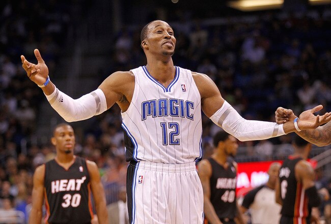 ORLANDO, FL - DECEMBER 21: Dwight Howard #12 of the Orlando Magic argues a call during a preseason game against the Miami Heat at Amway Center on December 21, 2011 in Orlando, Florida. NOTE TO USER: User expressly acknowledges and agrees that, by downloading and/or using this Photograph, User is consenting to the terms and conditions of the Getty Images License Agreement.  (Photo by Mike Ehrmann/Getty Images)
