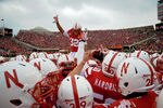 LINCOLN, NE - NOVEMBER 25: Cornerback Marcus Mendoza #32 of the Nebraska Cornhuskers jumps atop a pre game scrum as the Nebraska Cornhuskers prepare to plan the Iowa Hawkeyes at Memorial Stadium November 25, 2011 in Lincoln, Nebraska. Nebraska defeated Iowa 20-7. (Photo by Eric Francis/Getty Images)