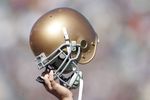 SOUTH BEND, IN - OCTOBER 07:  A member of Notre Dame Fighting Irish holds up his helmet on the opening kickoff during the game against the Stanford Cardinal on October 7, 2006 at Notre Dame Stadium in South Bend, Indiana.  (Photo by Andy Lyons/Getty Images)