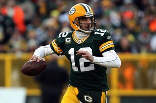 GREEN BAY, WI - JANUARY 15:  Aaron Rodgers #12 of the Green Bay Packers looks to pass against the New York Giants during their NFC Divisional playoff game at Lambeau Field on January 15, 2012 in Green Bay, Wisconsin.  (Photo by Jonathan Daniel/Getty Images)