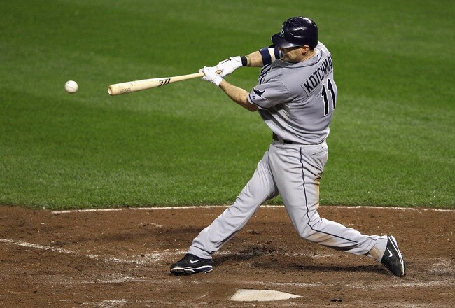 BALTIMORE, MD - SEPTEMBER 12: Casey Kotchman #11 of the Tampa Bay Rays connects on a pitch against the Baltimore Orioles at Oriole Park at Camden Yards on September 12, 2011 in Baltimore, Maryland.  (Photo by Rob Carr/Getty Images)