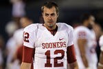 LAWRENCE, KS - OCTOBER 15:  Quarterback Landry Jones #12 of the Oklahoma Sooners walks along the sidelines during the game against the Kansas Jayhawks on October 15, 2011 at Memorial Stadium in Lawrence, Kansas.  (Photo by Jamie Squire/Getty Images)