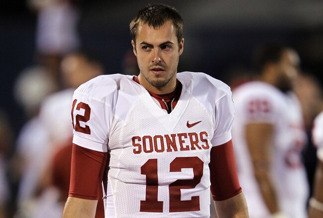 LAWRENCE, KS - OCTOBER 15:  Quarterback Landry Jones #12 of the Oklahoma Sooners walks along the sidelines during the game against the Kansas Jayhawks on October 15, 2011 at Memorial Stadium in Lawrence, Kansas.  (Photo by Jamie Squire/Getty Images)