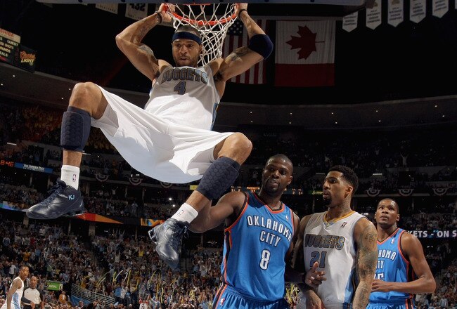 DENVER, CO - APRIL 23:  Kenyon Martin #4 of the Denver Nuggets dunks the ball as Nazr Mohammed #8 of the Oklahoma City Thunder, Wilson Chandler #21 of the Denver Nuggets and Kevin Durant #35 of the Oklahoma City Thunder look on in Game Three of the Western Conference Quarterfinals in the 2011 NBA Playoffs on April 23, 2011 at the Pepsi Center in Denver, Colorado. NOTE TO USER: User expressly acknowledges and agrees that, by downloading and or using this photograph, User is consenting to the terms and conditions of the Getty Images License Agreement.  (Photo by Doug Pensinger/Getty Images)