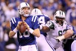 INDIANAPOLIS, IN - JANUARY 08:  Quarterback Peyton Manning #18 of the Indianapolis Colts looks to pass against the New York Jets during their 2011 AFC wild card playoff game at Lucas Oil Stadium on January 8, 2011 in Indianapolis, Indiana. The Jets won 17-16.  (Photo by Andy Lyons/Getty Images)