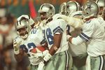 28 Jan 1996:  Running back Emmitt Smith #22 of the Dallas Cowboys is congratulated by teammates, including wide receiver Michael Irvin #88 and quarterback Troy Aikman #8, after scoring his second touchdown of the game in the fourth quarter of Super Bowl X