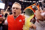 NEW ORLEANS, LA - JANUARY 04:  Head coach Jim Tressel of the Ohio State Buckeyes screams as Gatorade is dumped on him after the Buckeyes 31-26 victory against the Arkansas Razorbacks during the Allstate Sugar Bowl at the Louisiana Superdome on January 4, 2011 in New Orleans, Louisiana.  (Photo by Kevin C. Cox/Getty Images)