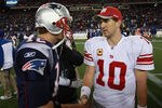 FOXBORO, MA - NOVEMBER 6:    Tom Brady #12 of the New England Patriots congratulates  Eli Manning #10 of the New York Giants after the New York Giants 24-20 win on November 6, 2011 in Foxboro, Massachusetts. (Photo by Jim Rogash/Getty Images)