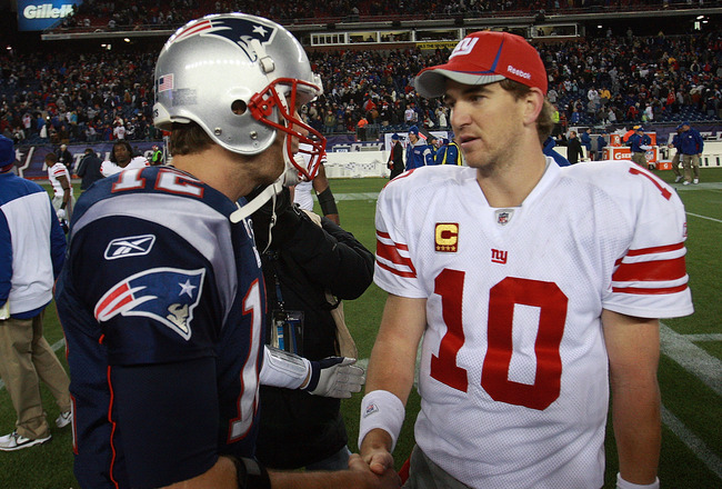 FOXBORO, MA - NOVEMBER 6:    Tom Brady #12 of the New England Patriots congratulates  Eli Manning #10 of the New York Giants after the New York Giants 24-20 win on November 6, 2011 in Foxboro, Massachusetts. (Photo by Jim Rogash/Getty Images)