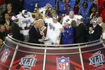 GLENDALE, AZ - FEBRUARY 03:  Quarterback Eli Manning #10 of the New York Giants holds the Vince Lombardi Trophy after defeating the New England Patriots 17 0 14 after Super Bowl XLII on February 3, 2008 at the University of Phoenix Stadium in Glendale, Arizona.  (Photo by Jim McIsaac/Getty Images)