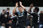 LONDON, ENGLAND - JANUARY 28:  John Terry of Chelsea celebrates victory after the FA Cup with Budweiser Fourth Round match between Queens Park Rangers and Chelsea at Loftus Road on January 28, 2012 in London, England.  (Photo by Clive Mason/Getty Images)