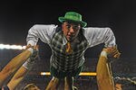 ORLANDO, FL - DECEMBER 29: The mascot of the Notre Dame Fight Irish does pushups after a touchdown against the Florida State Seminoles in the Champs Sports Bowl December 29, 2011 at the Florida Citrus Bowl in Orlando, Florida.  FSU won 18 - 14. (Photo by Al Messerschmidt/Getty Images)