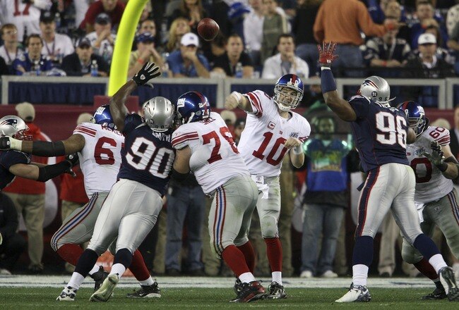 GLENDALE, AZ - FEBRUARY 03:  Quarterback Eli Manning #10 of the New York Giants throws the ball during Super Bowl XLII against the New England Patriots on February 3, 2008 at the University of Phoenix Stadium in Glendale, Arizona.  (Photo by Andy Lyons/Getty Images)