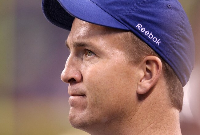 INDIANAPOLIS, IN - NOVEMBER 27:  Peyton Manning of the Indianapolis Colts watches the action during the game against the Carolina Panthers at Lucas Oil Stadium on November 27, 2011 in Indianapolis, Indiana.  (Photo by Andy Lyons/Getty Images)