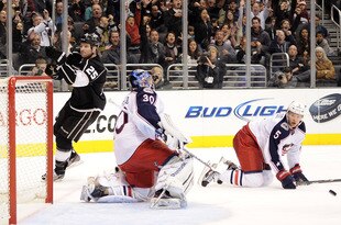 LOS ANGELES, CA - FEBRUARY 01:  Dustin Penner #25 of the Los Angeles Kings celebrates his goal for a 2-1 lead in front of Aaron Johnson #5 and Curtis Sanford #30 of the Columbus Blue Jackets during the second period at Staples Center on February 1, 2012 in Los Angeles, California.  (Photo by Harry How/Getty Images)