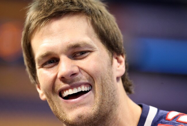 INDIANAPOLIS, IN - JANUARY 31:  Tom Brady #12 of the New England Patriotsanswers questions from the media during Media Day ahead of Super Bowl XLVI against the New York Giants at Lucas Oil Stadium on January 31, 2012 in Indianapolis, Indiana.  (Photo by Andy Lyons/Getty Images)