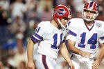 TAMPA, FL - JANUARY 27:  Kicker Scott Norwood #11 and  quarterback Frank Reich #14 of the Buffalo Bills walk n the field during Super Bowl XXV against the New York Giants at Tampa Stadium on January 27, 1991 in Tampa, Florida.  The Giants won 20-19.  (Photo by George Rose/Getty Images)