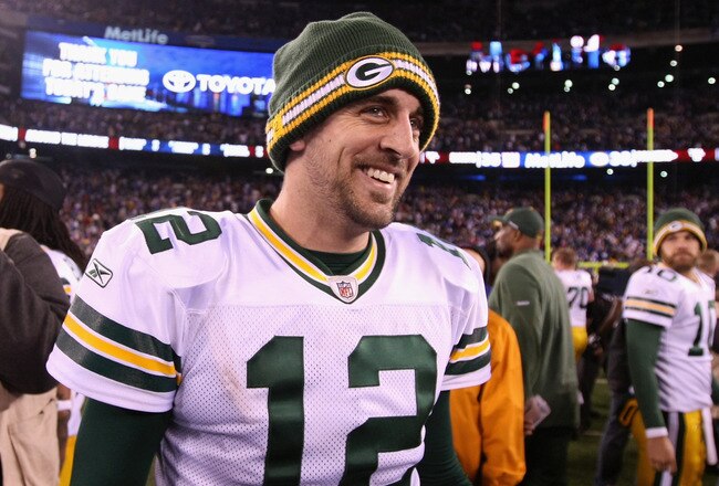EAST RUTHERFORD, NJ - DECEMBER 04:  Aaron Rodgers #12 of the Green Bay Packers celebrates after the Packers won 38-35 against the New York Giants at MetLife Stadium on December 4, 2011 in East Rutherford, New Jersey.  (Photo by Al Bello/Getty Images)