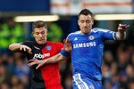 LONDON, ENGLAND - JANUARY 08:  John Terry of Chelsea battles with Marko Futacs of Portsmouth during the FA Cup sponsored by Budweiser Third Round match between Chelsea and Portsmouth at Stamford Bridge on January 8, 2012 in London, England.  (Photo by Paul Gilham/Getty Images)
