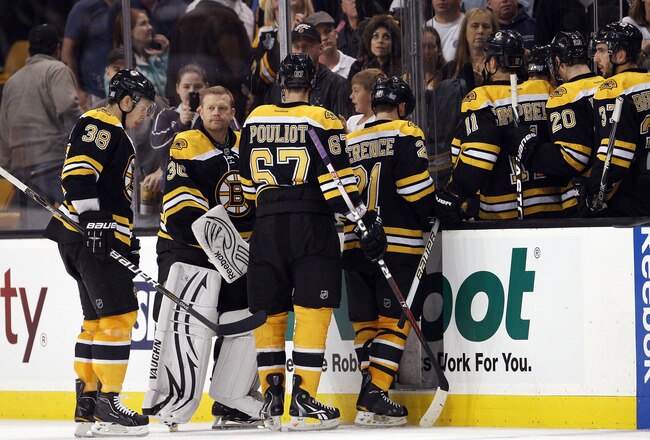 BOSTON, MA - OCTOBER 18:  The Boston Bruins head into the locker room after the game against the Carolina Hurricanes on October 18, 2011 at TD Garden in Boston, Massachusetts. The Carolina Hurricanes defeated the Boston Bruins 4-1.  (Photo by Elsa/Getty Images)